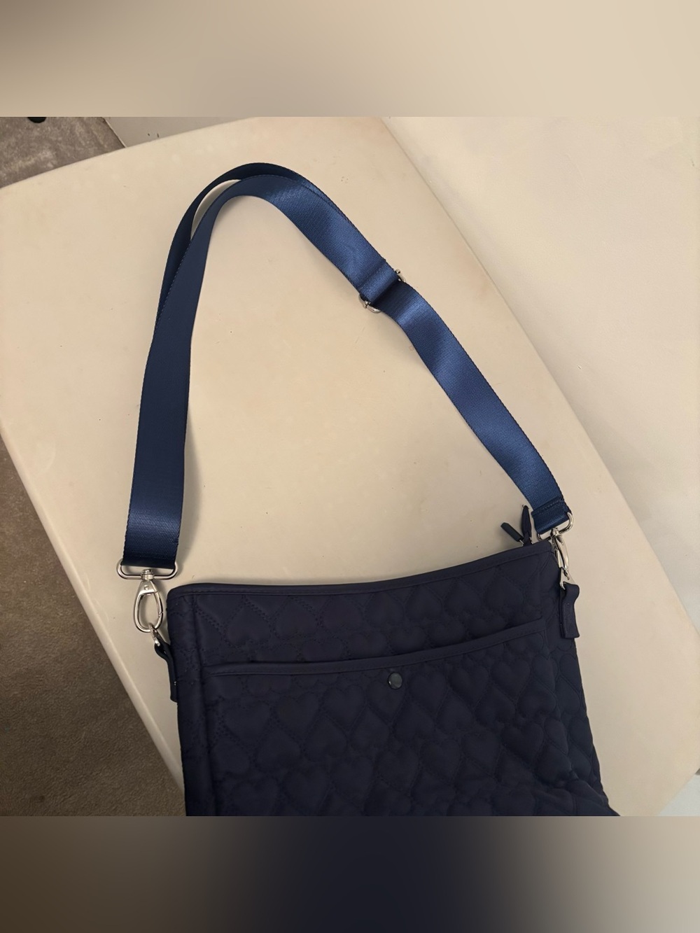 More Love" Heart Quilted Messenger Crossbody from the brand IHKWIP.